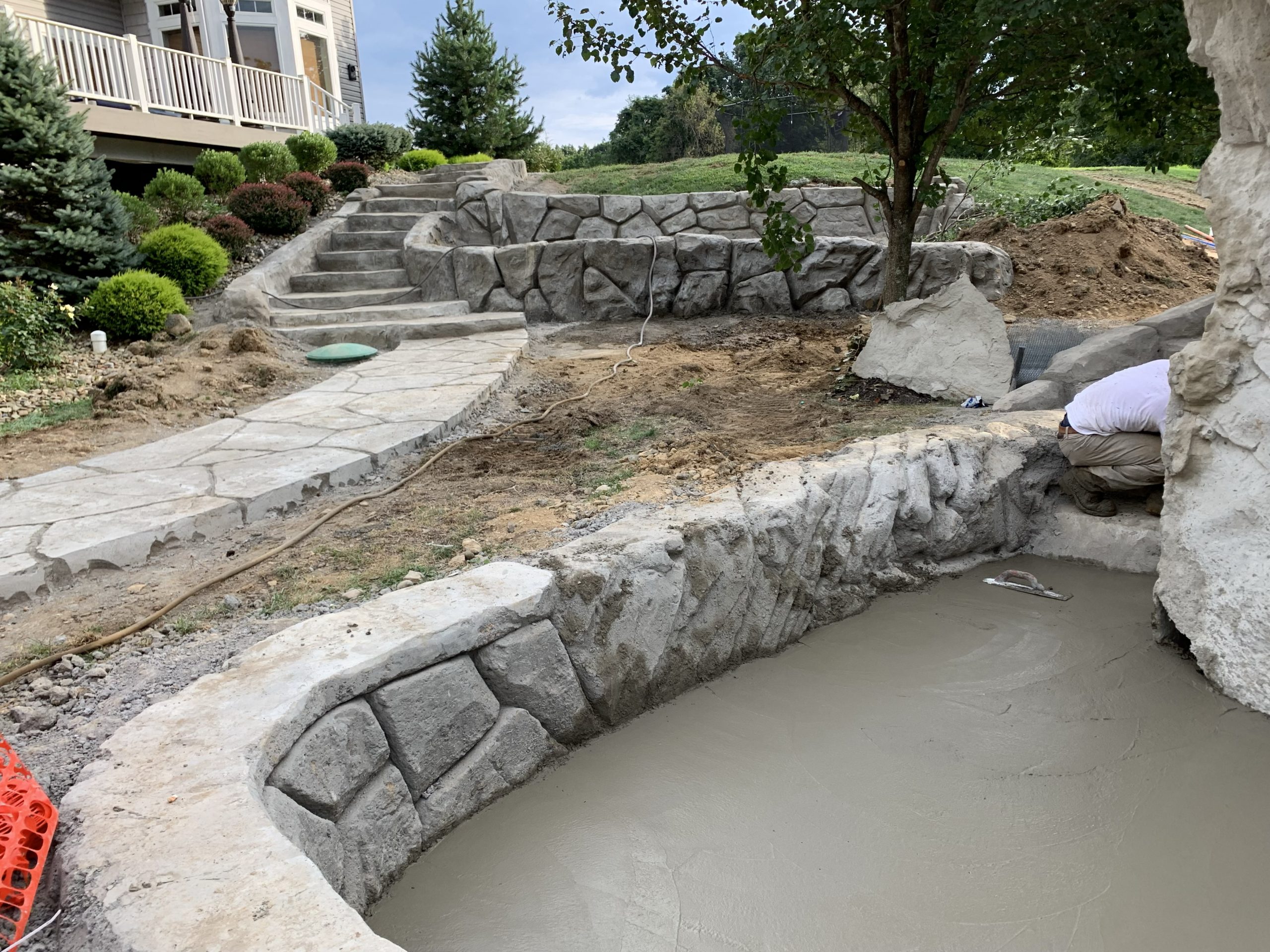 Hand-formed retaining wall