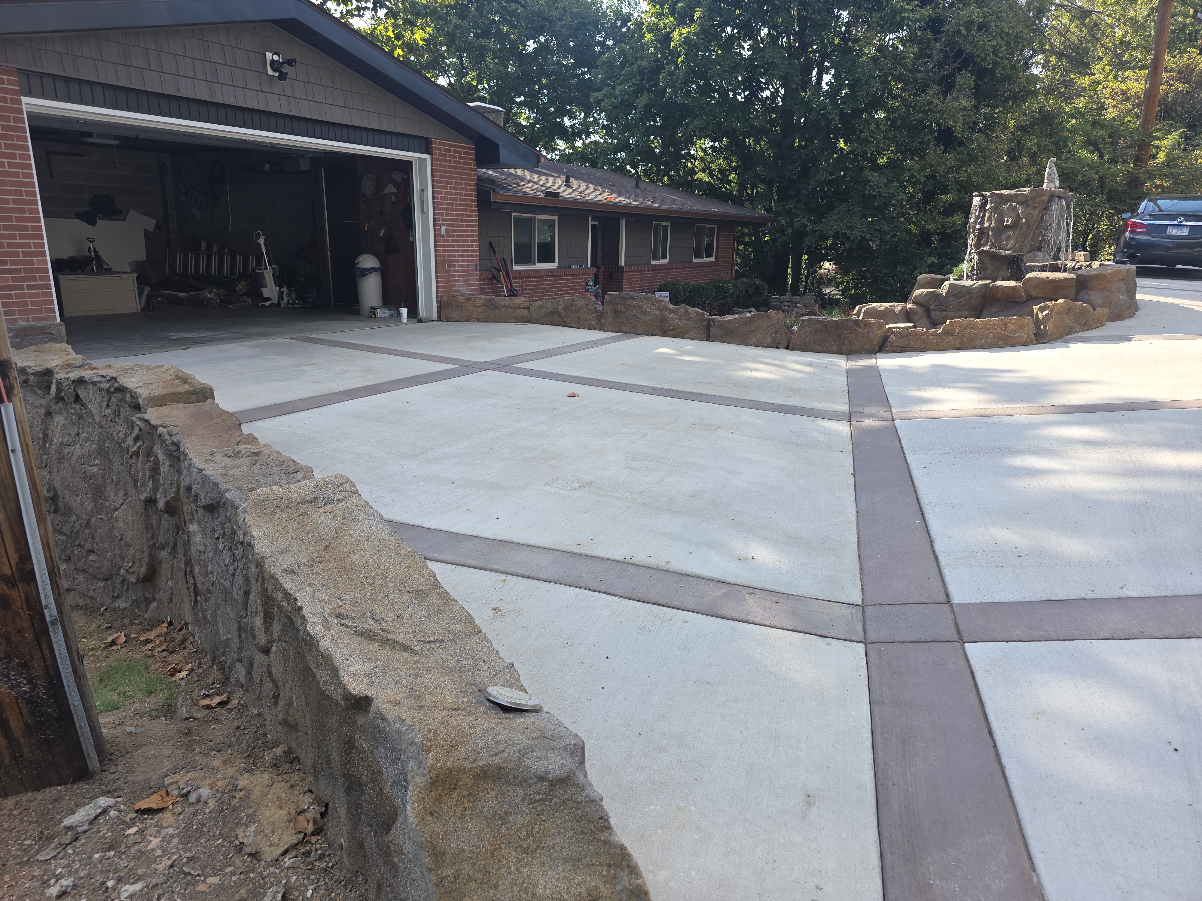 Retaining wall, driveway, and water feature