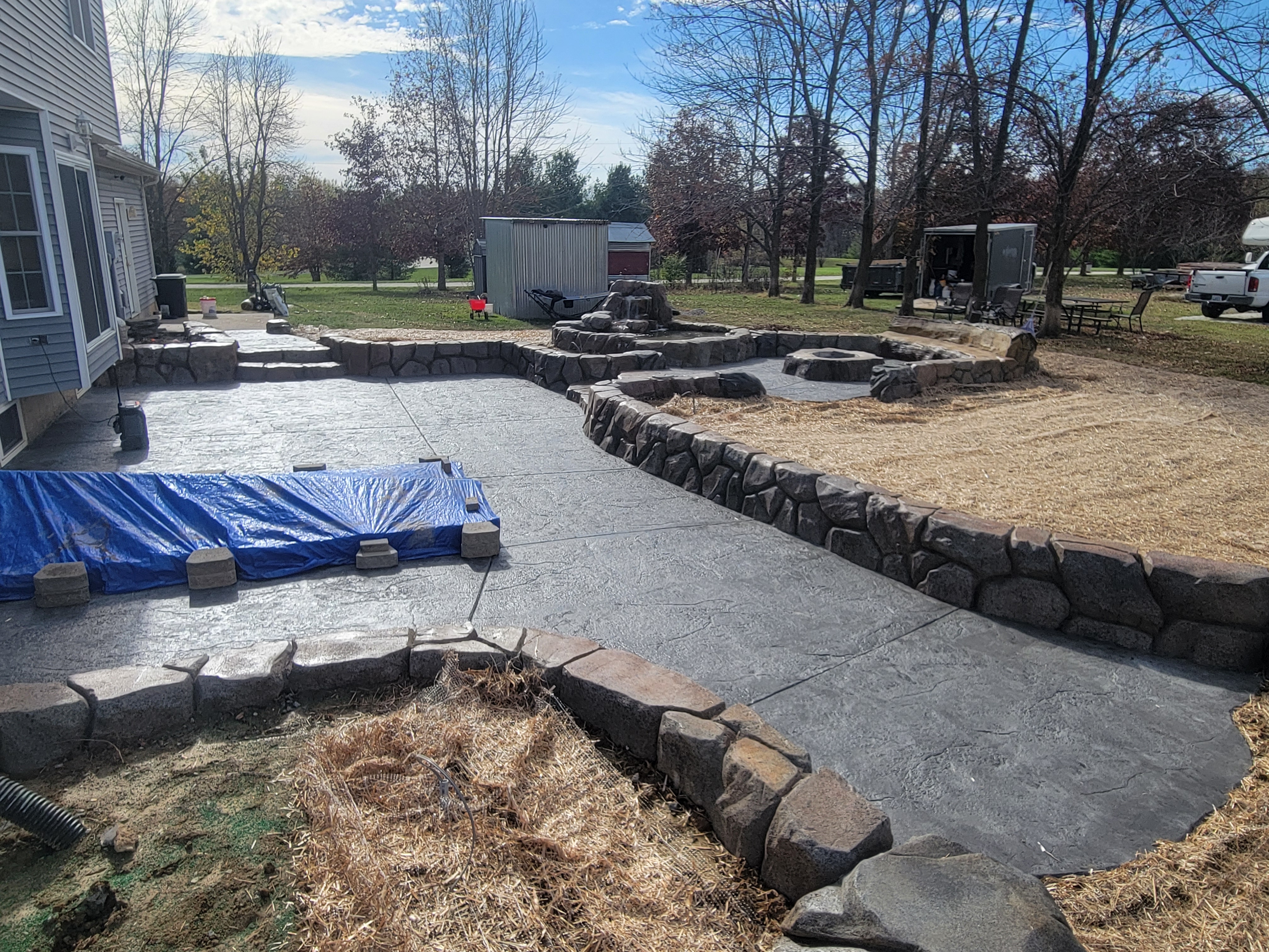 Retaining wall, patio, and fire pit